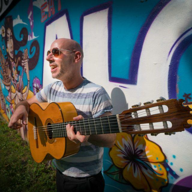 an image of The Flamenco Thief holding a guitar