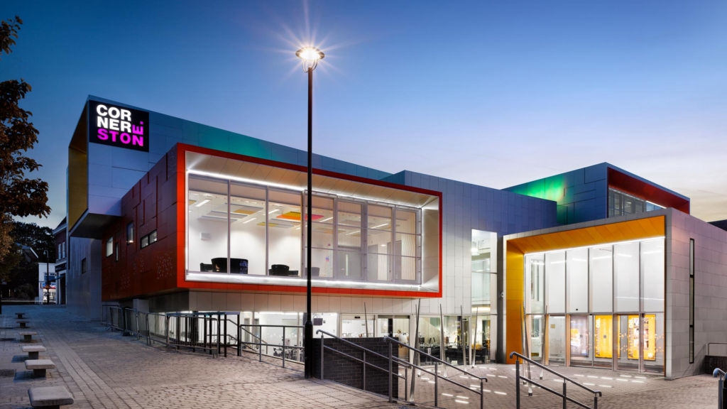 The outside of the Cornerstone building at night.