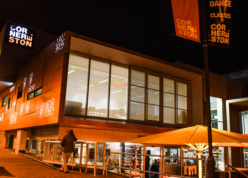 Outside of the Cornerstone building at night.