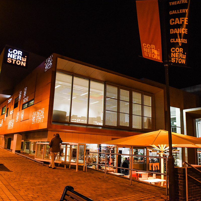Outside of the Cornerstone building at night.