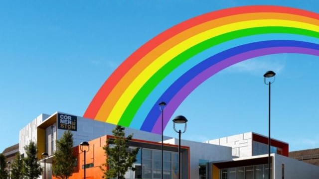 An advert for pride showing a cartoon rainbow above the Cornerstone building.